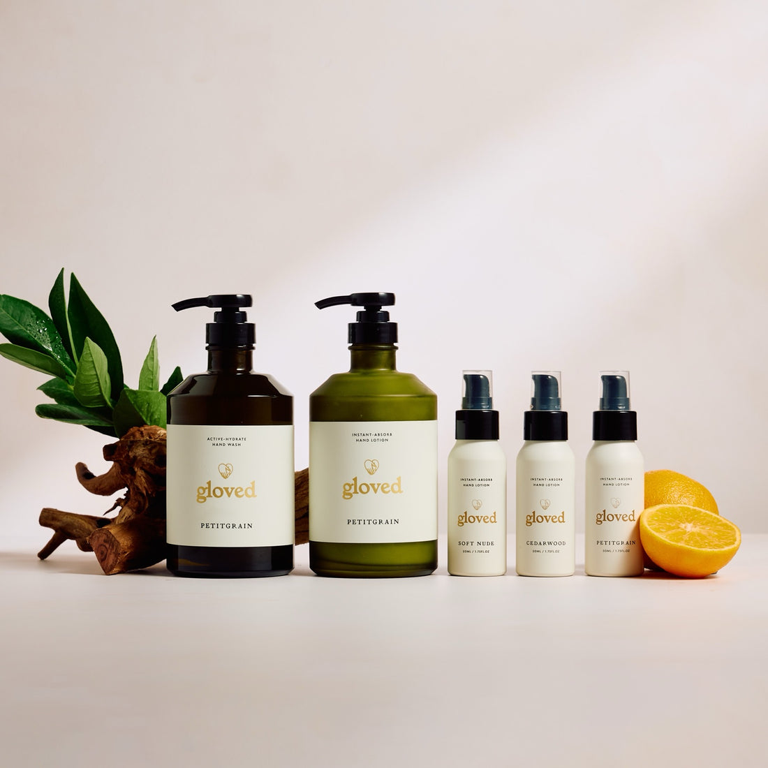 The Petitgrain Starter Set: hand wash, hand lotion and three mini lotions, photographed in the scent studio