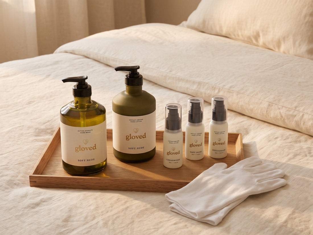 The Starter Set on a wooden tray on a bed, next to a pair of white cotton gloves